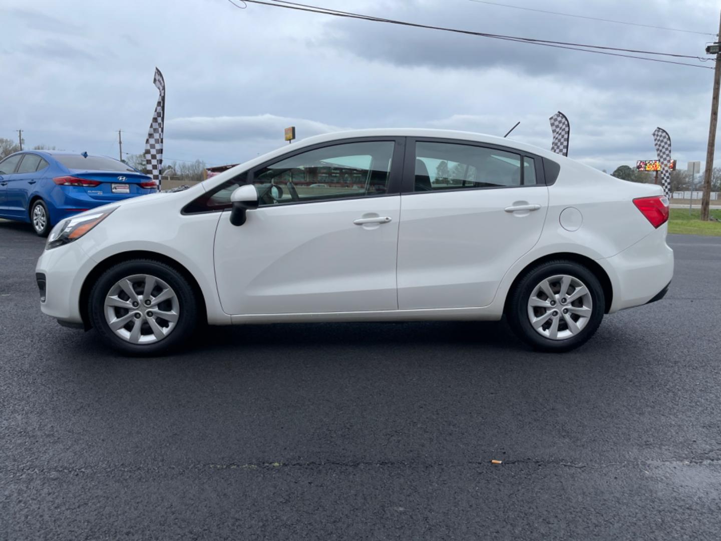 2014 White Kia Rio (KNADN4A35E6) with an 4-Cyl, 1.6 Liter engine, Automatic, 6-Spd transmission, located at 8008 Warden Rd, Sherwood, AR, 72120, (501) 801-6100, 34.830078, -92.186684 - Photo#4